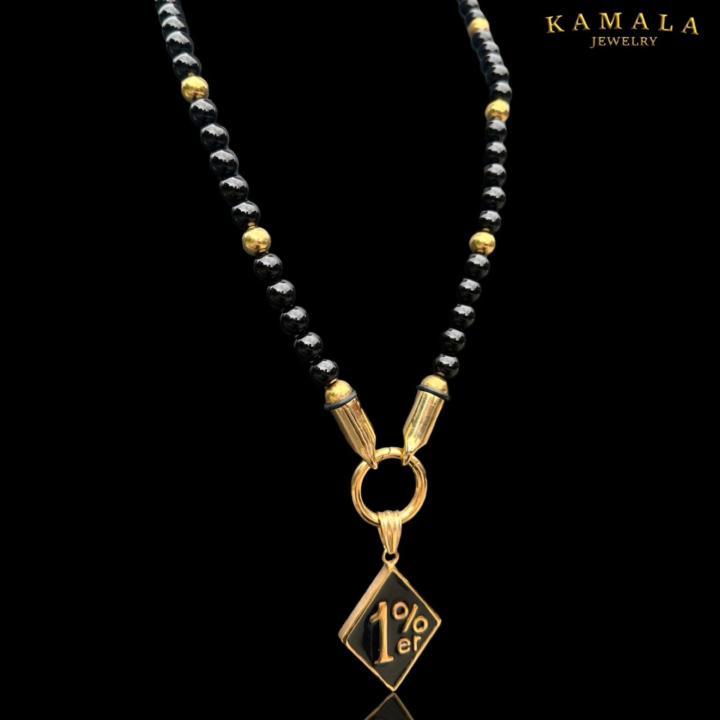 Perlenkette aus Schwarze Steine und Gold